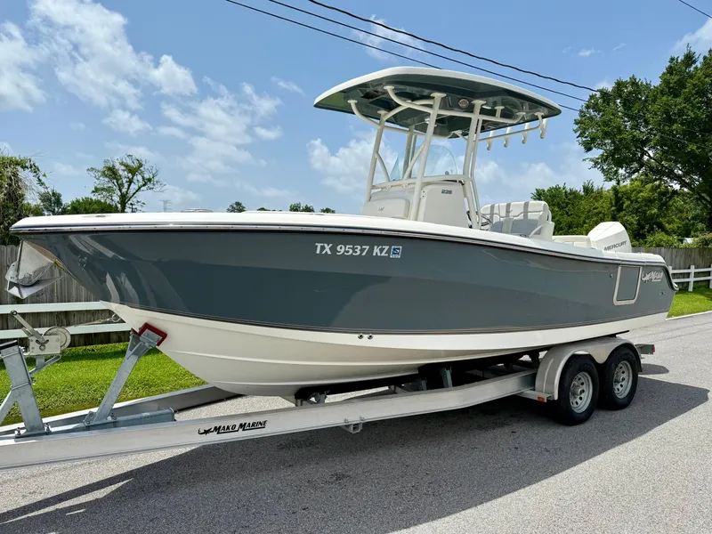 The Image of 2020 Mako 236 CC boat on trailer, parked on a sunny street. - 1