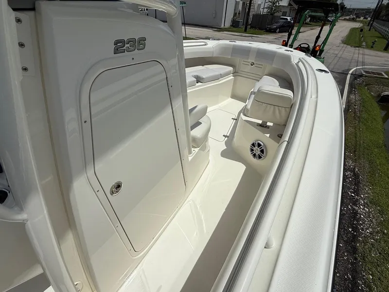 Slide: The Image of 2020 Mako 236 CC boat interior with seating and storage compartments. - 15