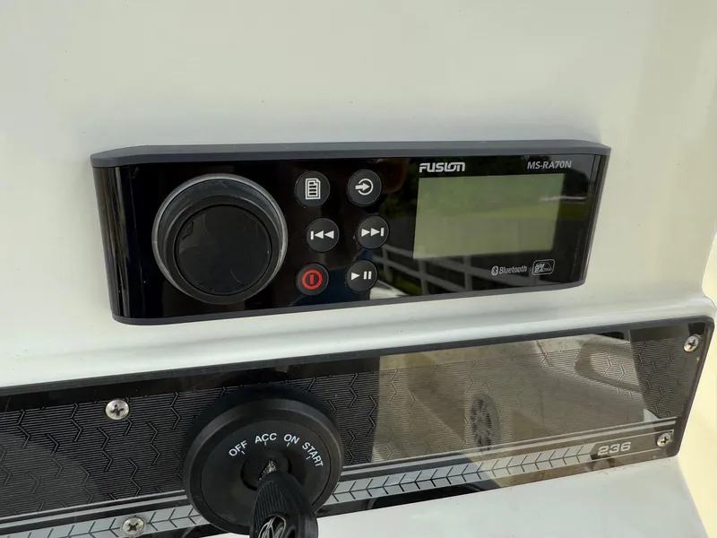Slide: The Image of Control panel of a 2020 Mako 236 CC boat with Fusion audio system. - 19