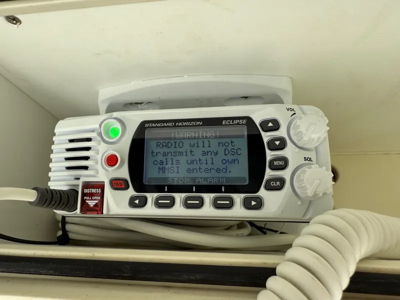 Slide: The Image of VHF marine radio on 2020 Mako 236 CC boat, displaying warning message. - 20