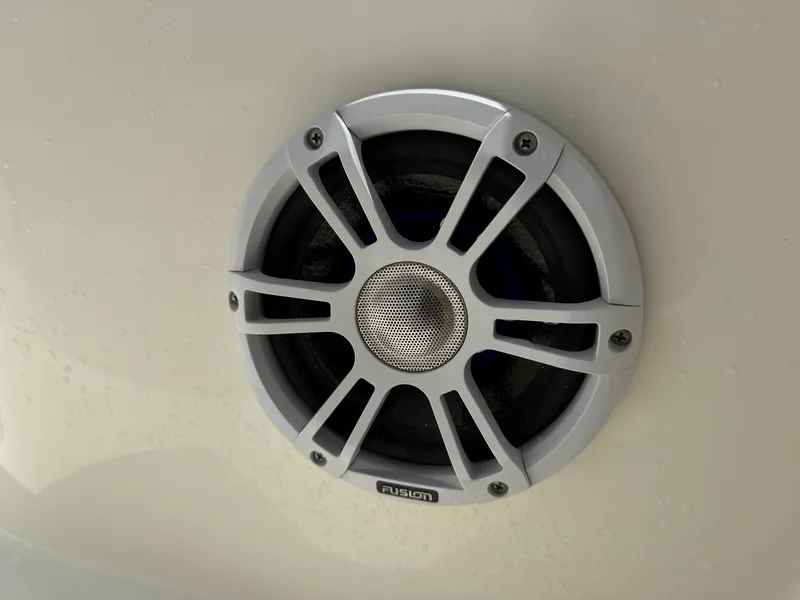 Slide: The Image of Close-up of a Fusion marine speaker on a 2020 Mako 236 CC boat. - 21