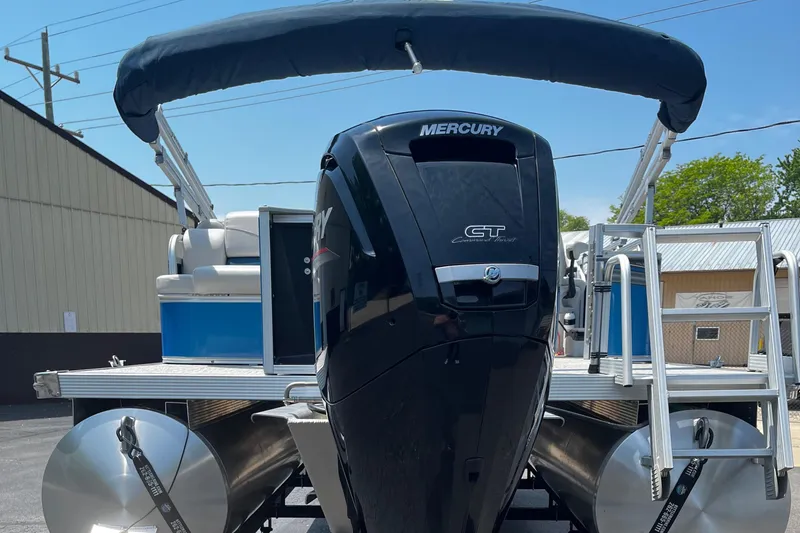 Slide: The Image of 2022 Tahoe 182 S boat with Mercury engine, docked outdoors. - 18