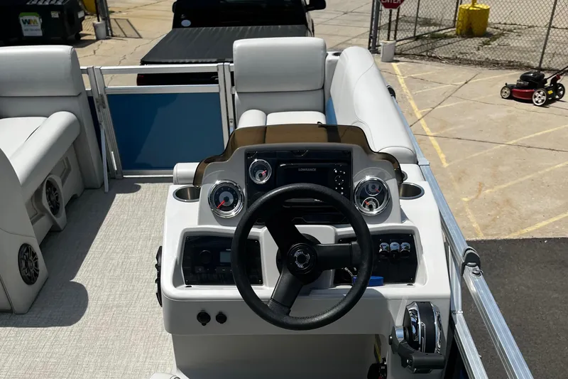 Slide: The Image of 2022 Tahoe 182 S boat interior with steering wheel and dashboard controls. - 19