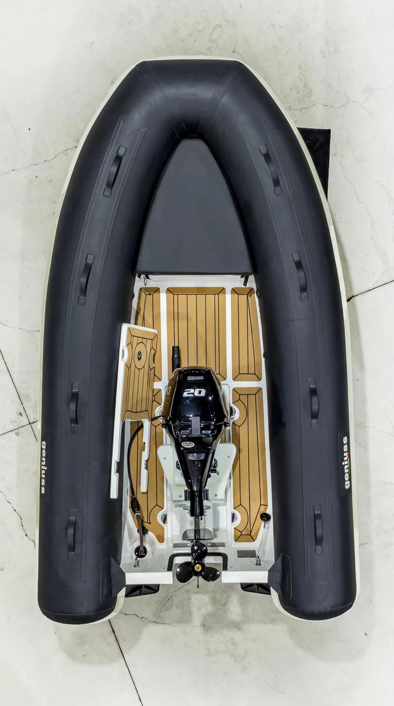 Slide: The Image of 2025 Geniuss 330 Cruiser inflatable boat with wooden deck and outboard motor, top view. - 12