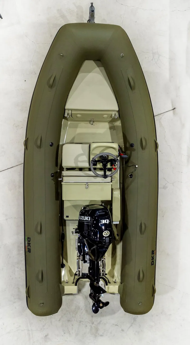 Slide: The Image of 2025 Geniuss 330 Cruiser inflatable boat with outboard motor, top view. - 13