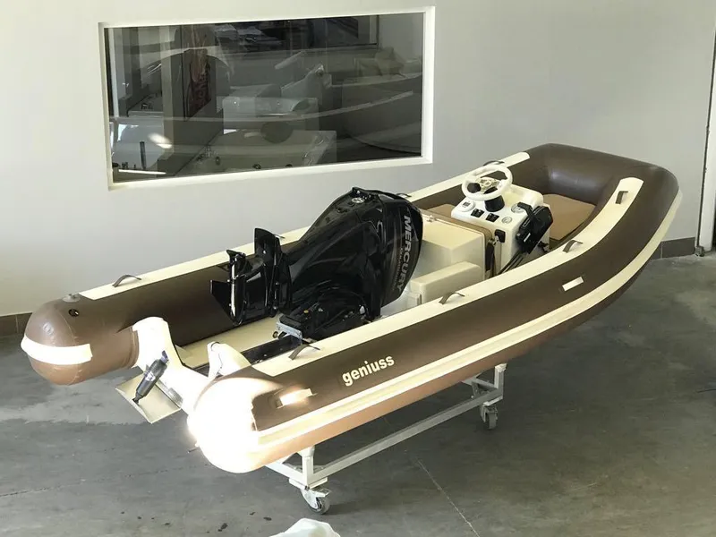 Slide: The Image of 2025 Geniuss 330 Cruiser inflatable boat with outboard motor in showroom. - 14