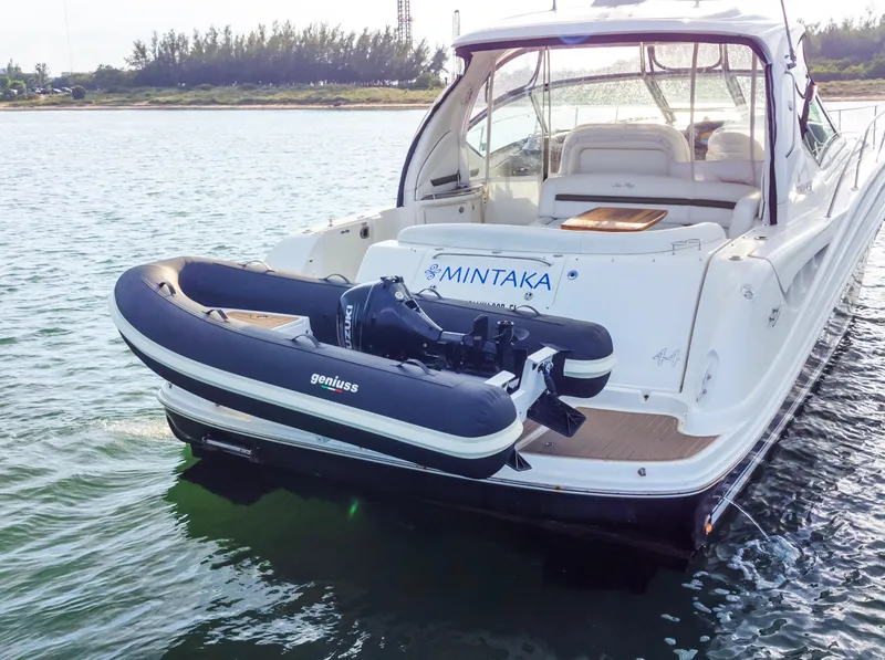 Slide: The Image of Luxury Geniuss 330 Cruiser yacht with inflatable boat, 2025 model, on calm water. - 16