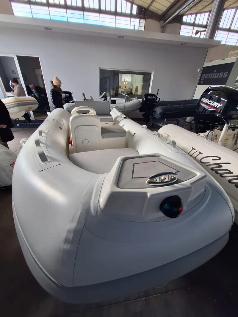 Slide: The Image of 2025 Geniuss 330 Cruiser inflatable boat displayed indoors. - 21