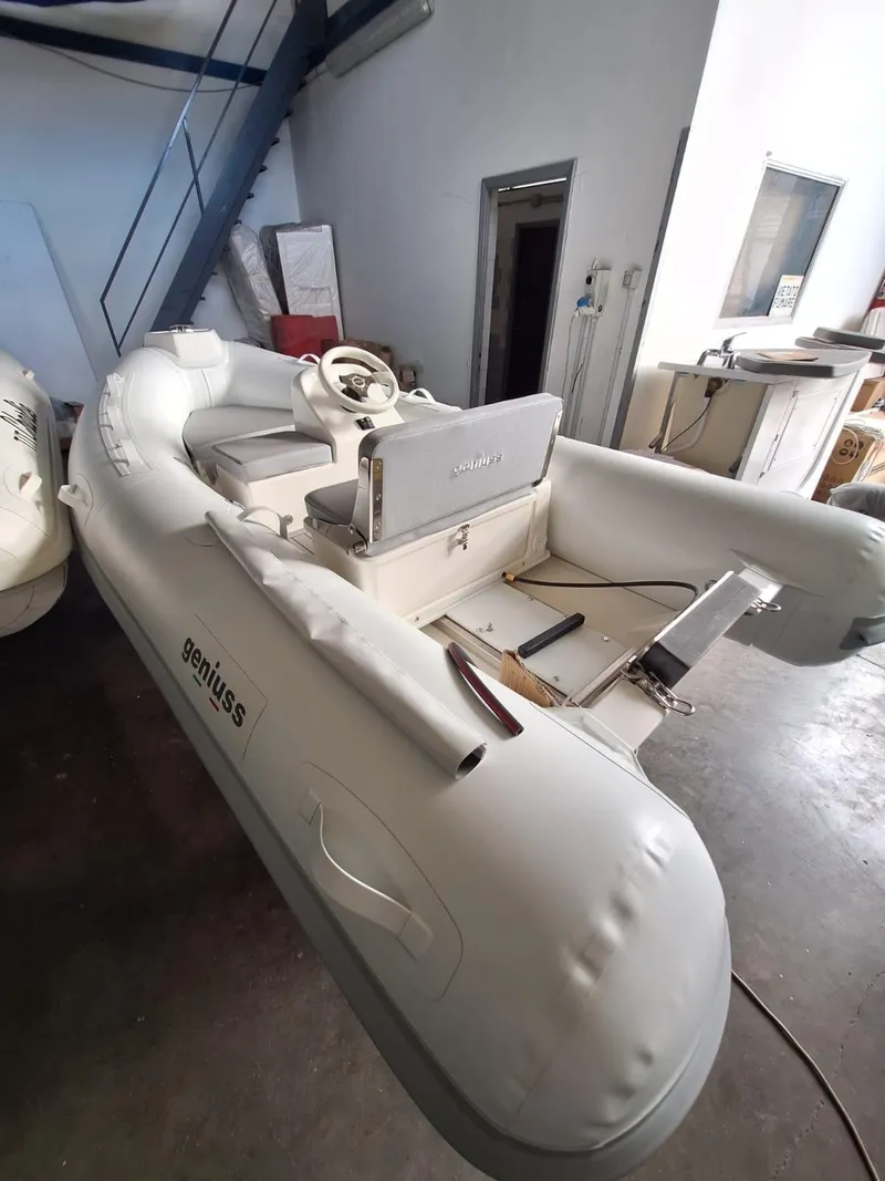 Slide: The Image of 2025 Geniuss 330 Cruiser inflatable boat in a garage setting. - 22