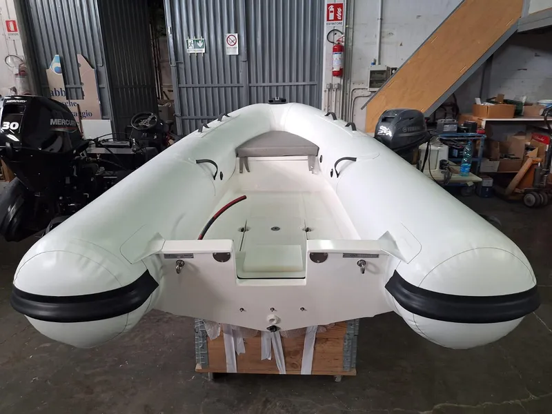 Slide: The Image of 2025 Geniuss 330 Cruiser inflatable boat in a workshop setting. - 25