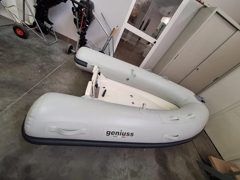 Slide: The Image of Inflatable Geniuss 330 Cruiser boat, 2025 model, in a garage setting. - 28