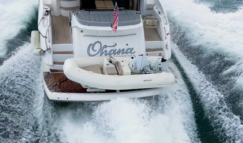 Slide: The Image of 2025 Geniuss 330 Cruiser yacht with tender, navigating through ocean waves. - 8