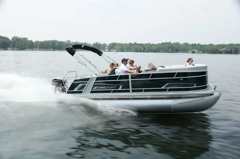 The Image of Starcraft EX 20 pontoon boat 2026 cruising on a calm lake. - 0