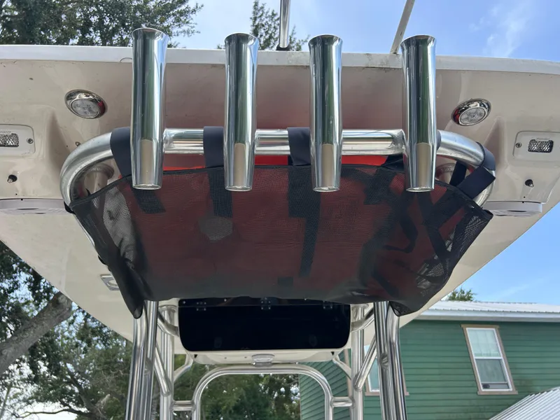 Slide: The Image of 2023 Key West 239 FS boat with rod holders and storage net on T-top. - 15