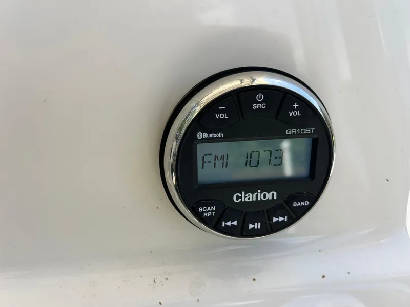 Slide: The Image of Clarion radio display on 2023 Key West 239 FS boat, tuned to FM 107.3. - 16