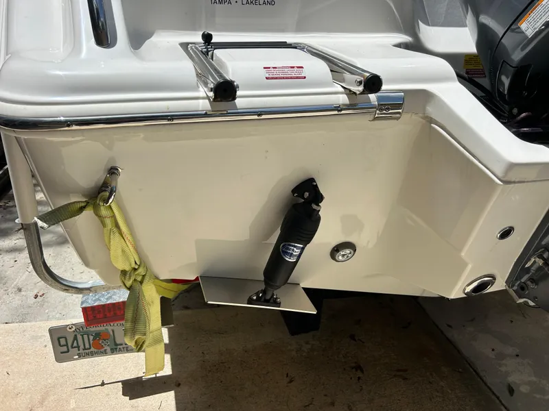 Slide: The Image of 2023 Key West 239 FS boat stern with trim tab and Florida license plate. - 5