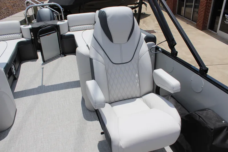 Slide: The Image of 2025 Tahoe Pontoon Cascade Quad Lounger with luxurious white seating and modern design. - 14