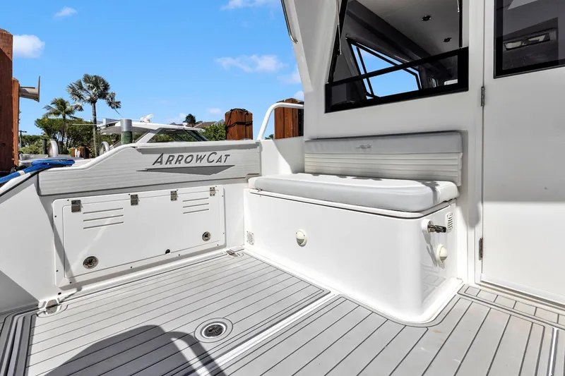 Slide: The Image of 2023 ArrowCat Flybridge Dual Helm boat deck with seating and storage, featuring sleek design. - 25