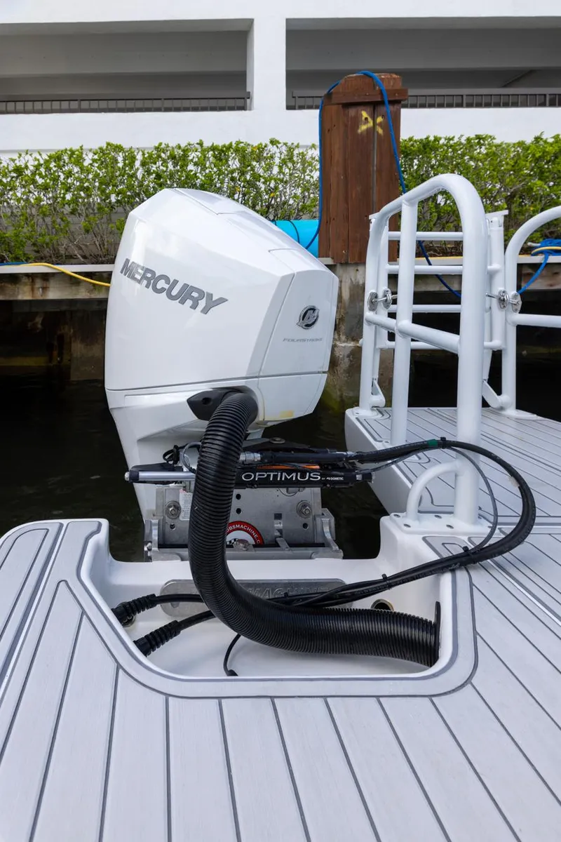 Slide: The Image of 2023 ArrowCat Flybridge Dual Helm with Mercury outboard engine at dockside. - 29