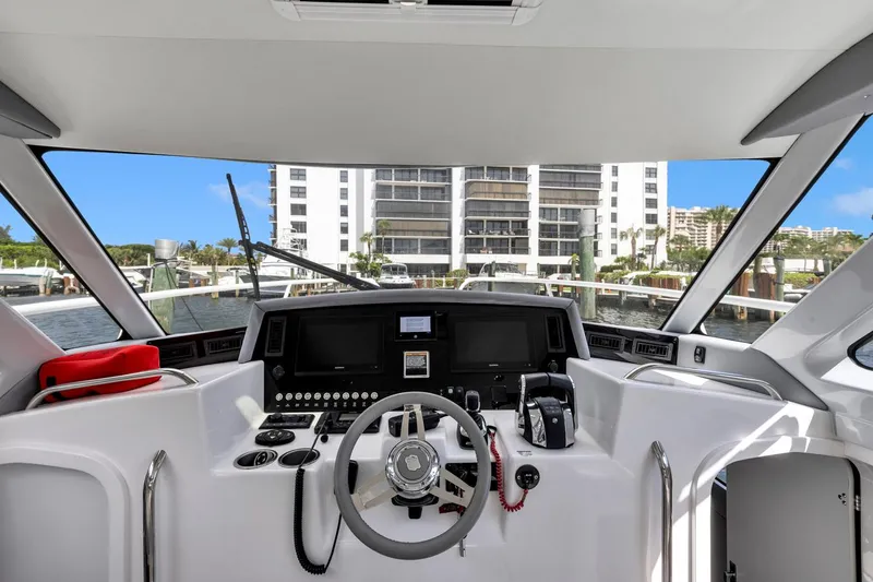 Slide: The Image of 2023 ArrowCat Flybridge Dual Helm yacht interior with modern controls and waterfront view. - 41