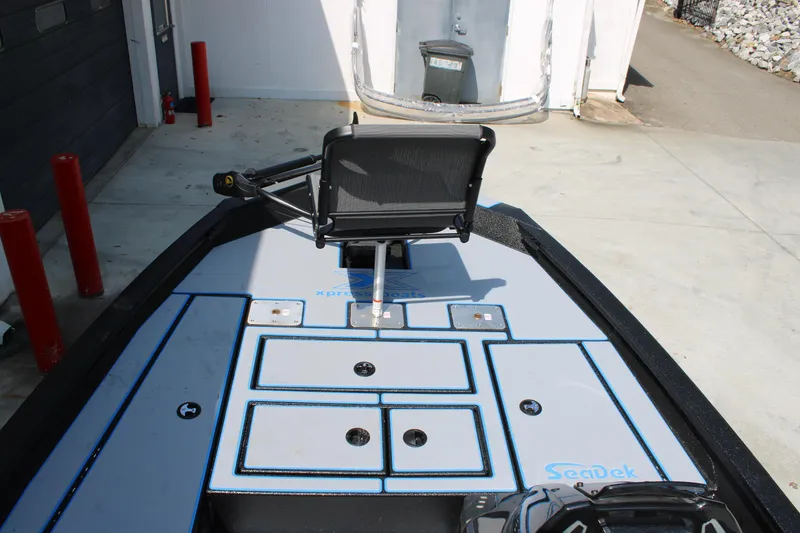 Slide: The Image of 2026 Xpress H18C Crappie boat deck with seating and storage compartments. - 3