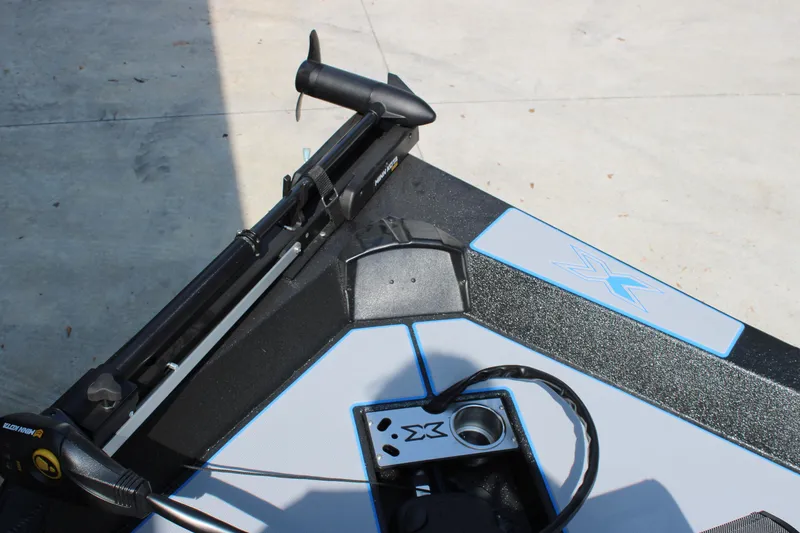 Slide: The Image of 2026 Xpress H18C Crappie boat deck with trolling motor and control panel. - 5