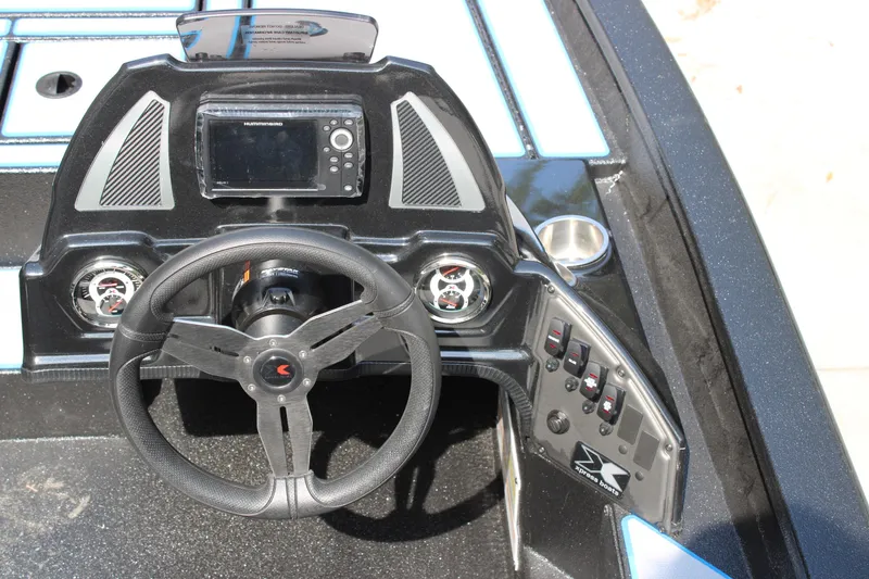 Slide: The Image of Steering console of 2026 Xpress H18C Crappie boat with modern controls and display. - 8