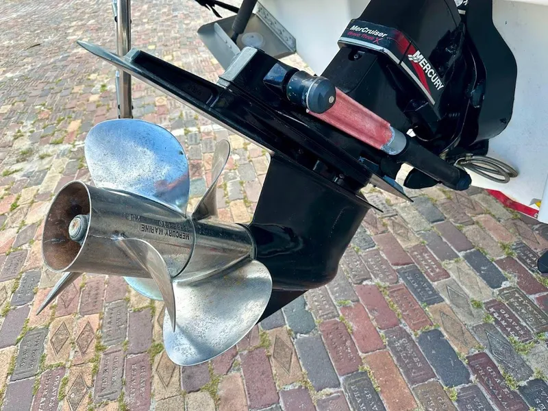 Slide: The Image of Close-up of a 2004 Sea Ray SUNDECK 270 boat propeller and engine on a brick surface. - 13