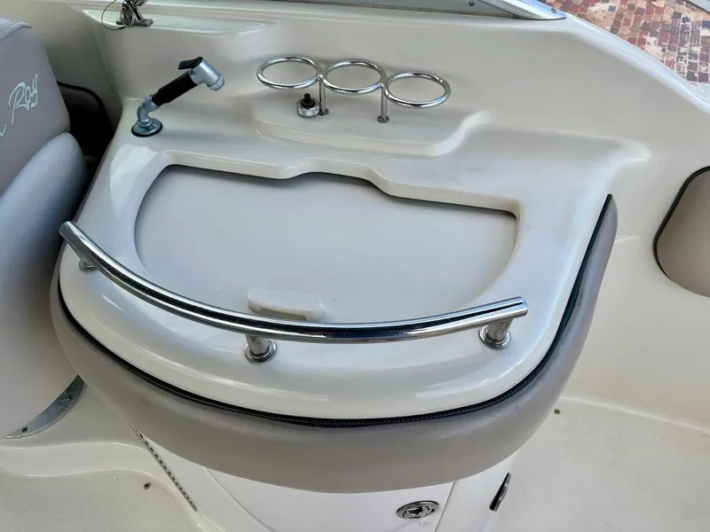 Slide: The Image of 2004 Sea Ray SUNDECK 270 boat interior with sink and cup holders. - 19