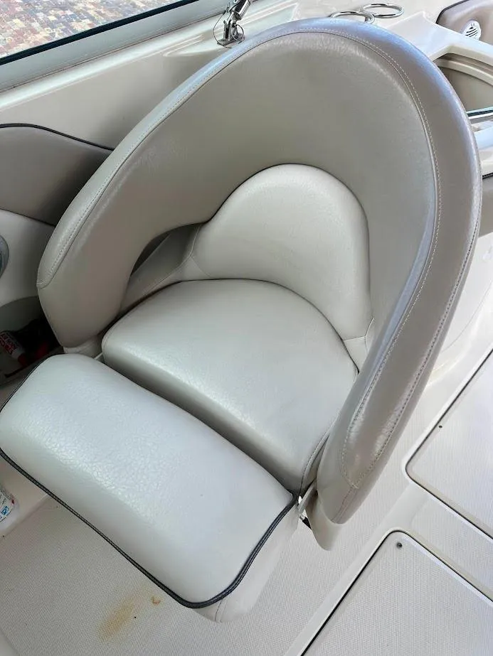 Slide: The Image of 2004 Sea Ray SUNDECK 270 boat seat with light gray upholstery. - 25