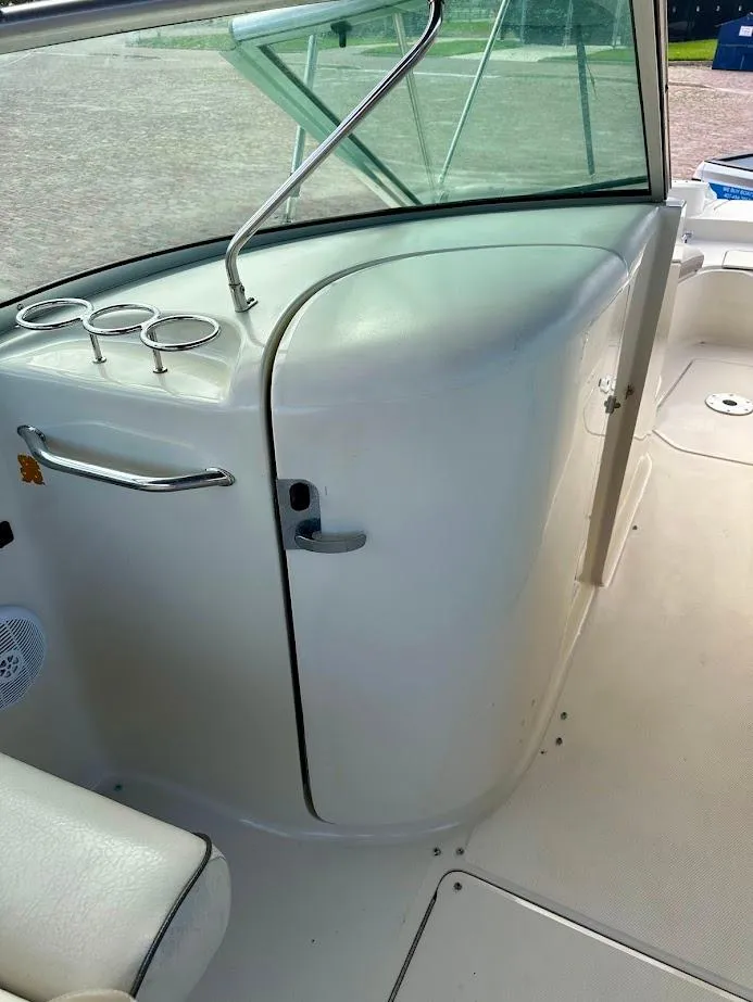 Slide: The Image of 2004 Sea Ray SUNDECK 270 interior with sleek design and modern amenities. - 27