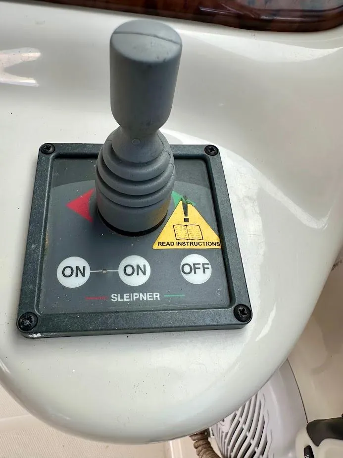 Slide: The Image of Control panel of a 2004 Sea Ray SUNDECK 270 boat with joystick and instructions. - 32