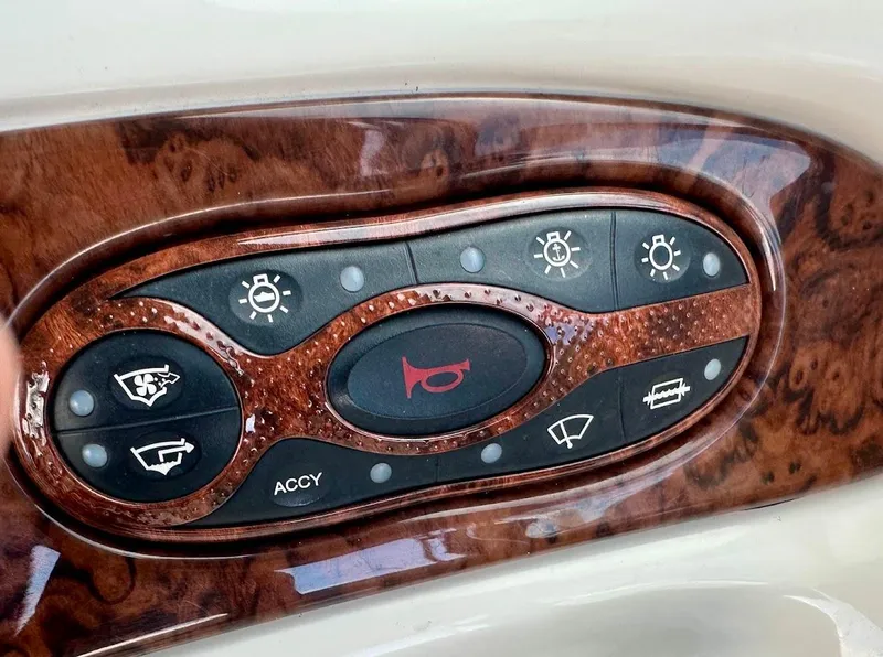 Slide: The Image of Control panel of a 2004 Sea Ray SUNDECK 270 boat with wood finish. - 33