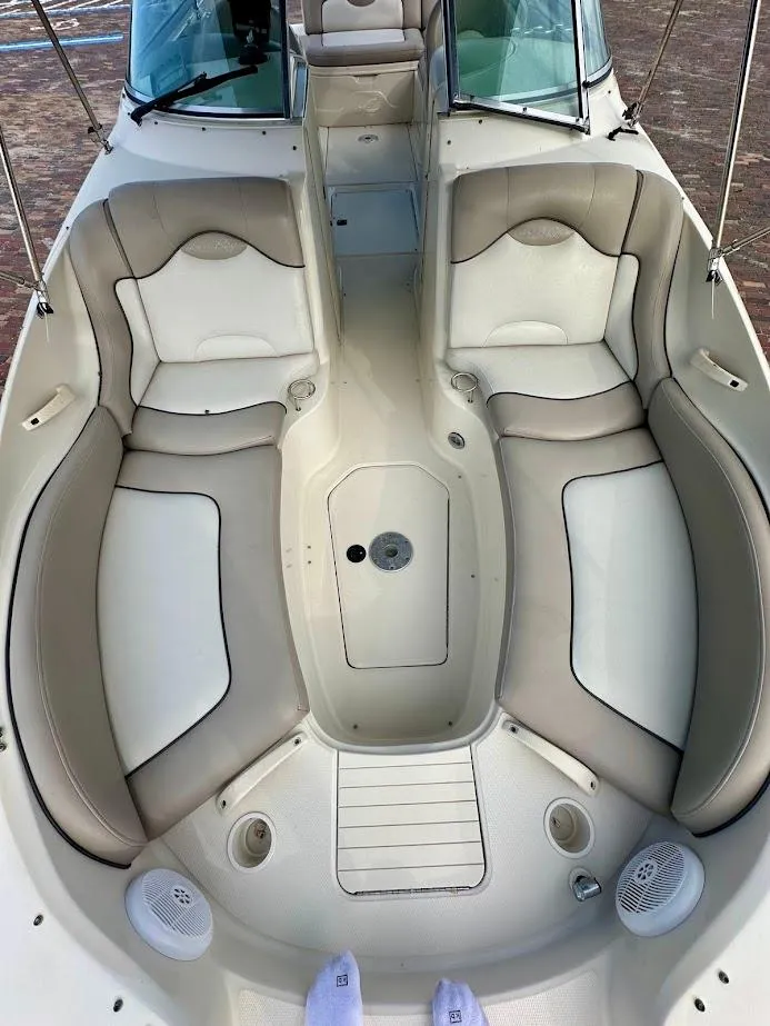 Slide: The Image of 2004 Sea Ray SUNDECK 270 boat interior with beige seating and white accents. - 38