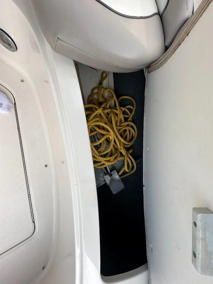 Slide: The Image of Yellow rope stored in a compartment of a 2004 Sea Ray SUNDECK 270 boat. - 40