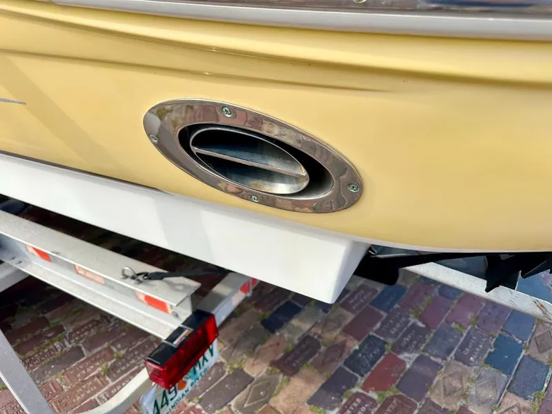 Slide: The Image of Close-up of a 2004 Sea Ray SUNDECK 270 boat exhaust on a trailer. - 5