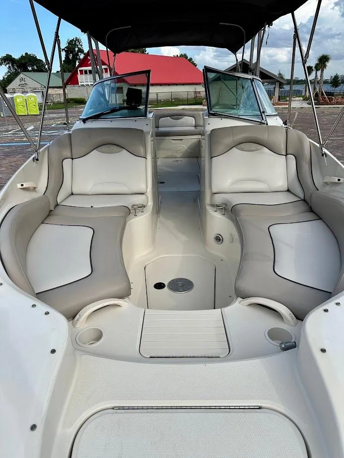 Slide: The Image of 2004 Sea Ray SUNDECK 270 boat interior with spacious seating and open deck. - 9