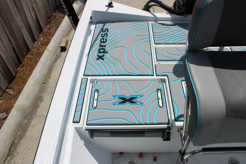 Slide: The Image of 2025 Xpress H20B boat deck with stylish blue and gray design. - 13