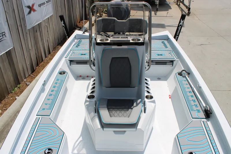 Slide: The Image of 2025 Xpress H20B boat interior with modern seating and storage compartments. - 7