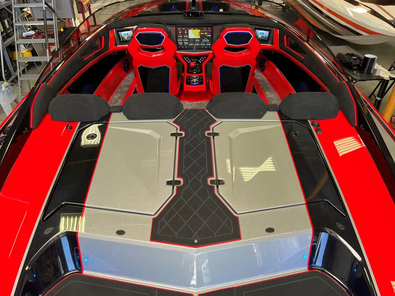 Slide: The Image of 2023 Daves Custom Boats M37R interior with red and black seating, advanced dashboard. - 17