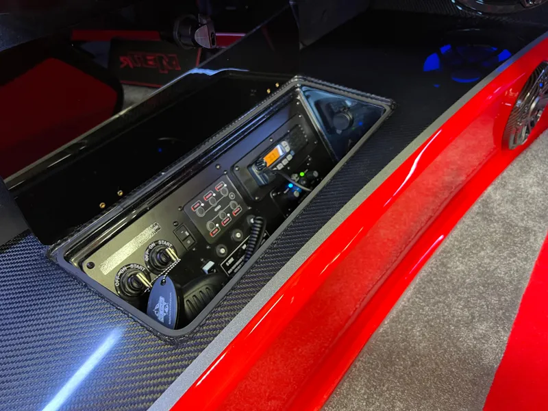 Slide: The Image of 2023 Daves Custom Boats M37R dashboard with control panel and carbon fiber finish. - 26