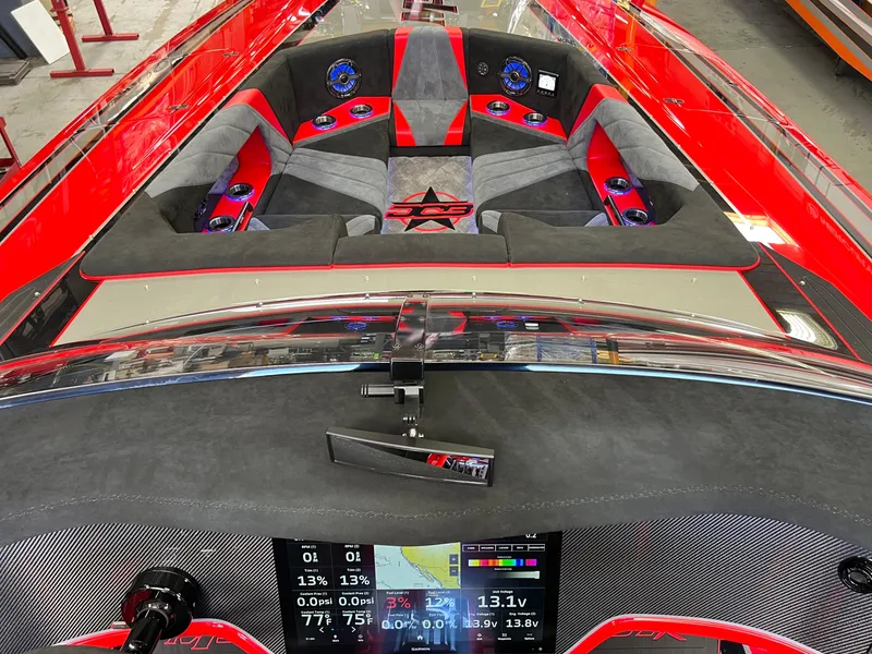 Slide: The Image of 2023 Daves Custom Boats M37R interior with red and gray seating, advanced dashboard display. - 30