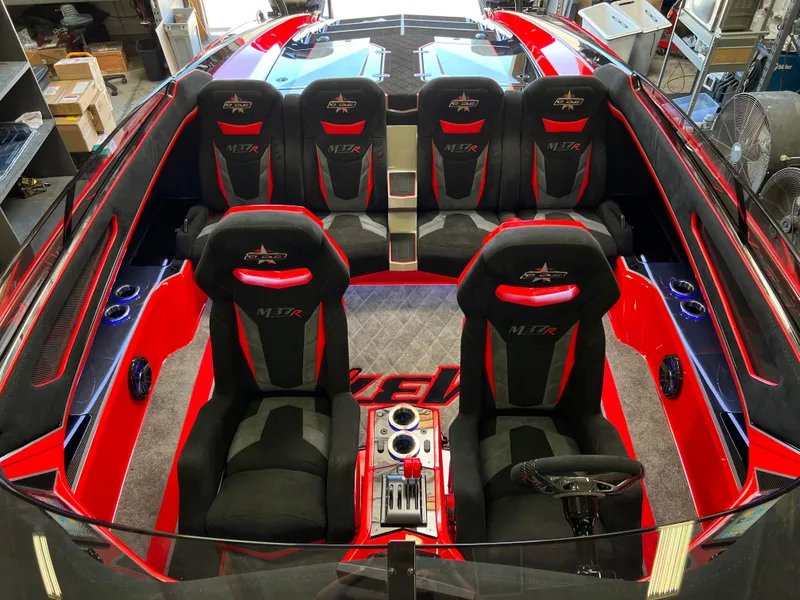 Slide: The Image of 2023 Daves Custom Boats M37R interior with red and black seating, sleek design. - 6
