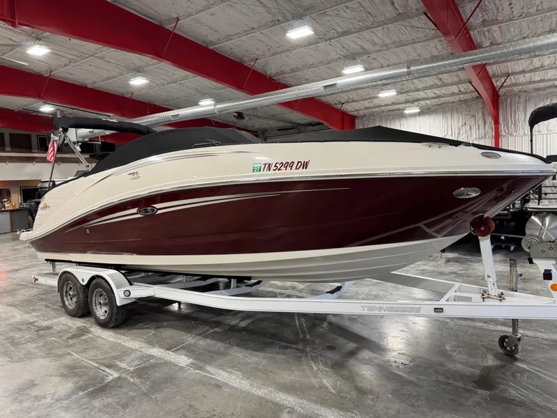 Slide: The Image of 2006 Sea Ray 260 Sundeck boat on trailer in indoor showroom. - 5
