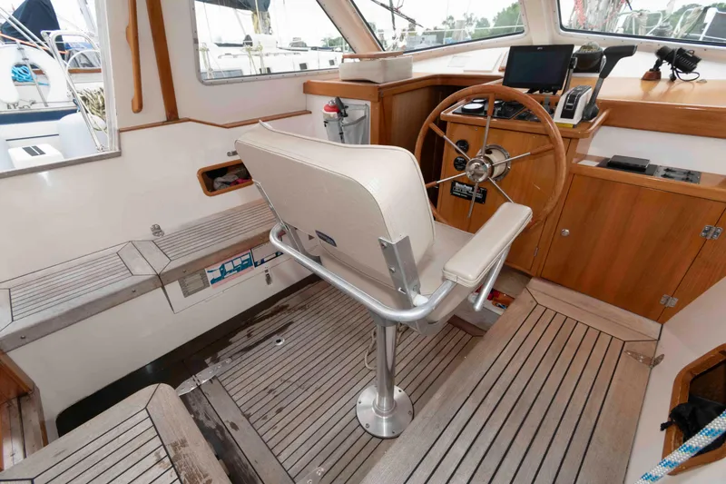 Slide: The Image of Interior of 2006 Vilm 117 yacht with steering wheel and navigation equipment. - 13