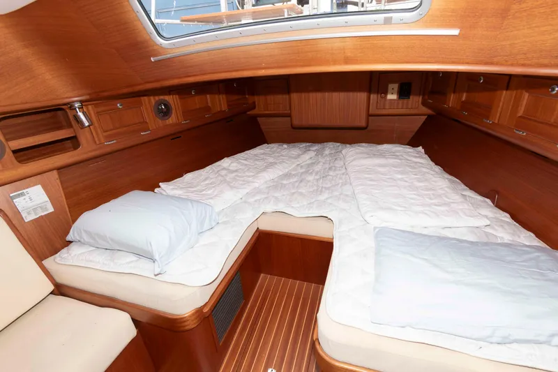 Slide: The Image of Cozy cabin interior of 2006 Vilm 117 yacht with wooden finish and bedding. - 22