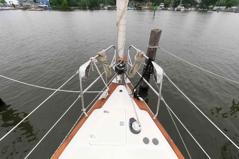 Slide: The Image of Bow of 2006 Vilm 117 sailboat docked on calm water. - 6