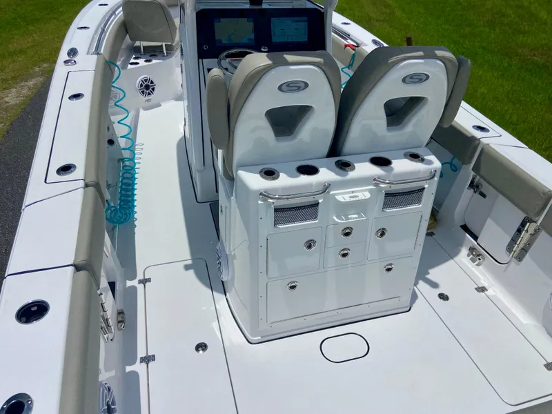 Slide: The Image of 2025 Sportsman Open 262 Center Console boat interior with seating and storage compartments. - 14