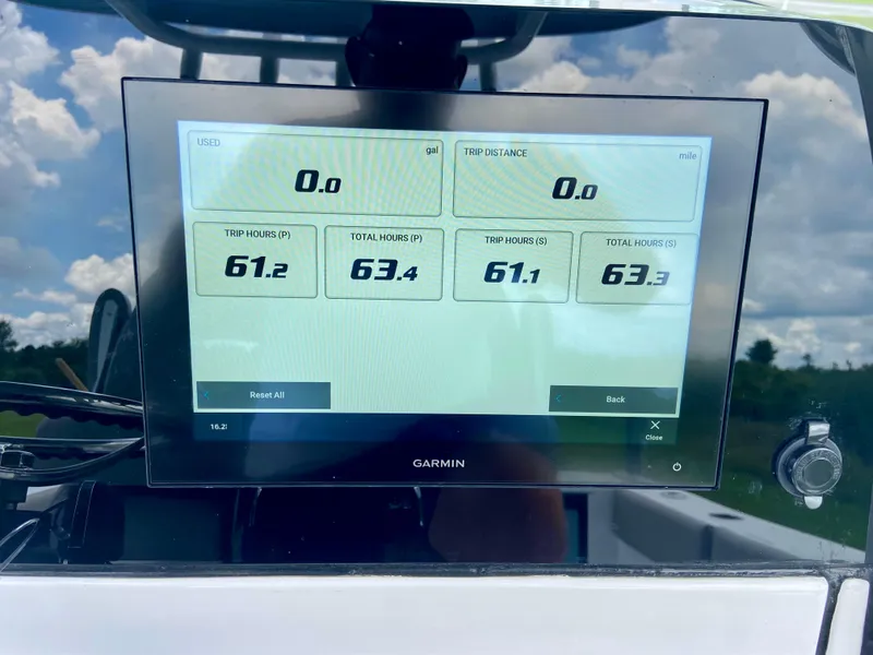 Slide: The Image of Garmin display on 2025 Sportsman Open 262 Center Console showing trip data and fuel metrics. - 15