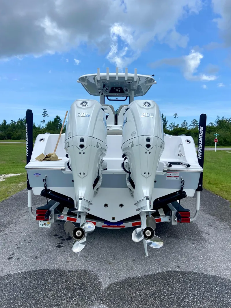 Slide: The Image of 2025 Sportsman Open 262 Center Console boat with dual outboard engines. - 20